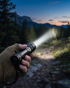 Rechargeable tactical flashlight beam outdoors, lifestyle